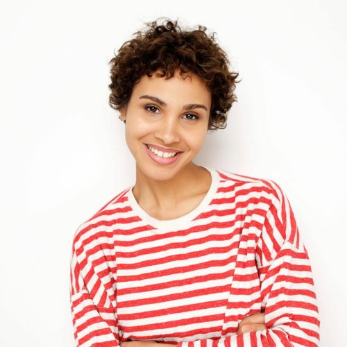 smiling-african-american-woman-in-striped-shirt-ag-2022-02-07-23-58-25-utc-scaled-e1654618066473-1.jpg